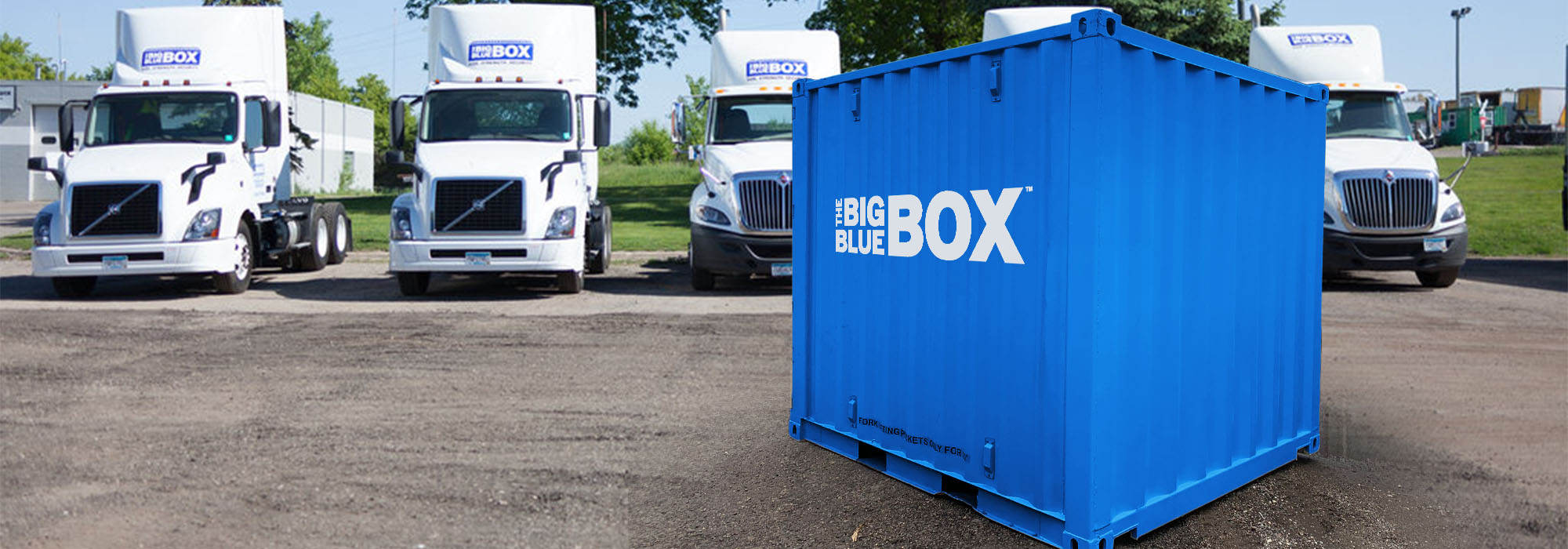 A mini storage container in a parking lot