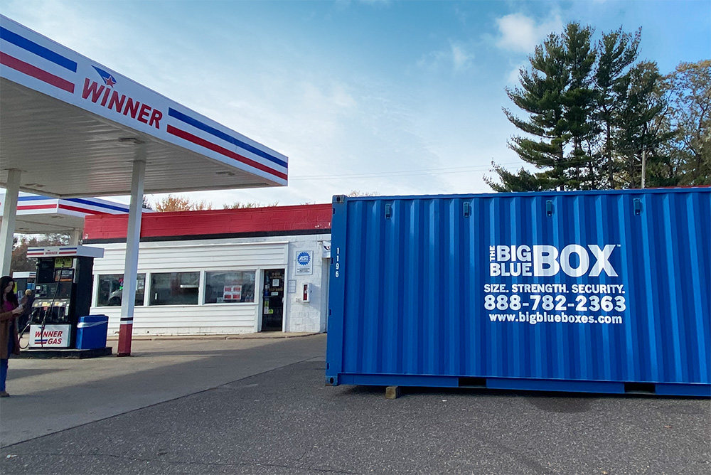 A storage box in a gas station parking lot