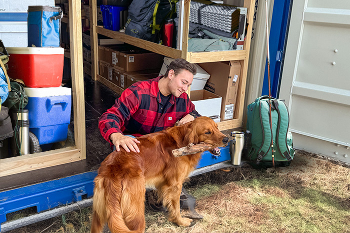 A man with a golden retriever