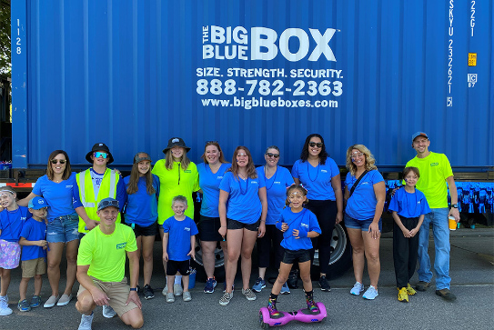 A group standing in front of BBB box